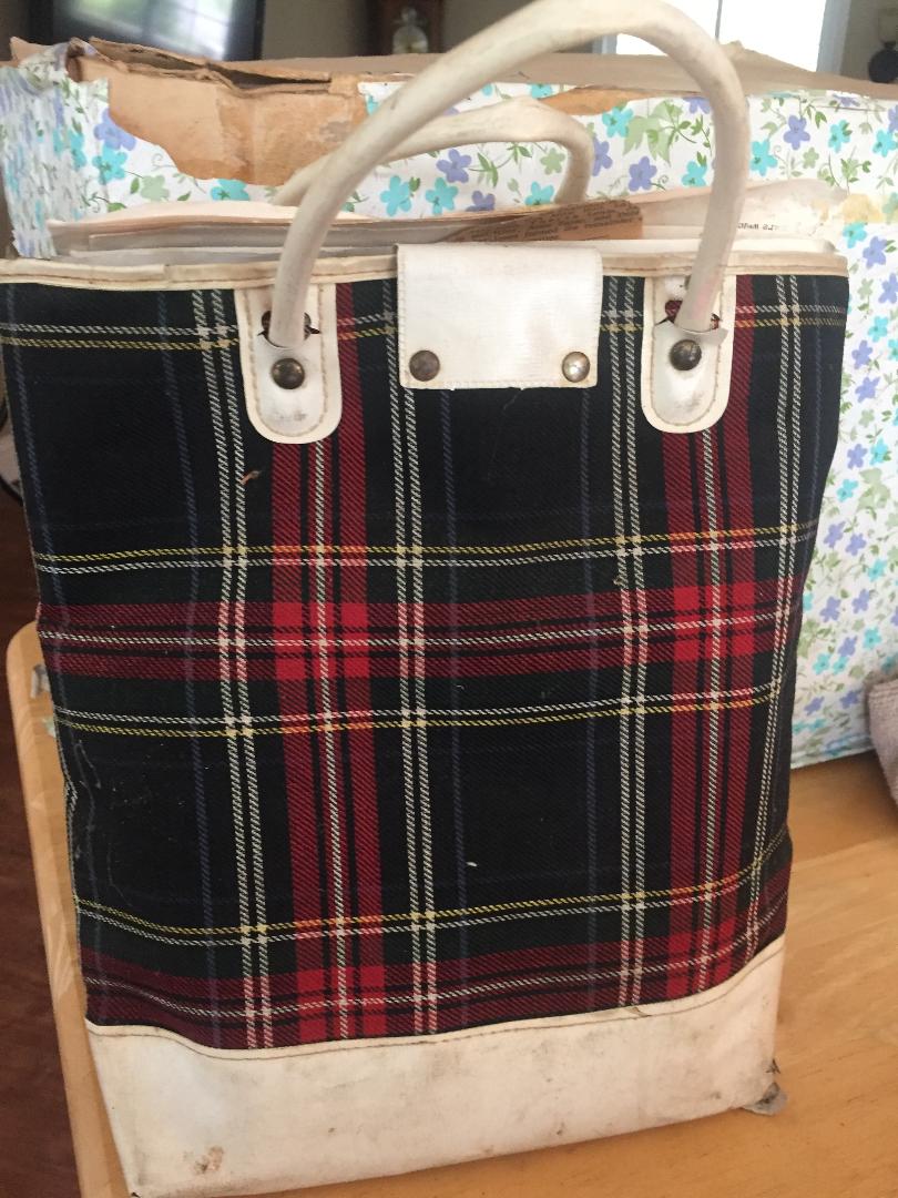 Peg's book bag from elementary school. The box in the back stored all her childhood mementos.